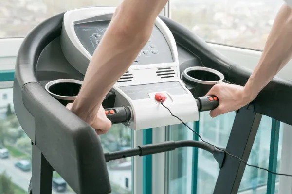 man-on-treadmill-control-panel-closeup-2026-01-08-07-15-34-utc1-69972bd5c00e0